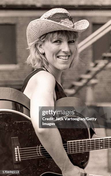 Backstage portrait of American country and folk musician Lucinda Williams prior to a performance at Central Park SummerStage, New York, New York,...