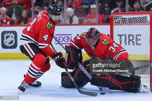 Petr Mrazek of the Chicago Blackhawks makes a save against the St. Louis Blues during the first period of a preseason game at the United Center on...