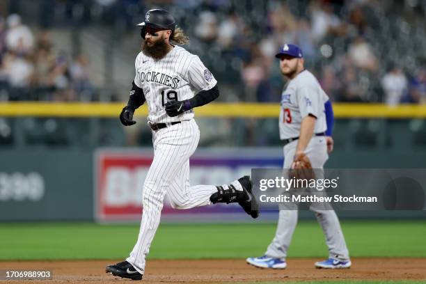 Charlie Blackmon of the Colorado Rockies circles the bases after hitting a home run against the Los Angeles Dodgers in the first inning at Coors...