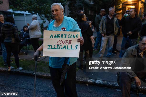 Neighborhood residents, joined by anti-migrant activists, hold an 8th demonstration and rally to protest the city housing migrants at a closed...