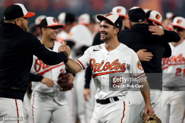 Adam Frazier of the Baltimore Orioles celebrates after the Orioles defeated the Boston Red Sox to win the the American League East at Oriole Park at...