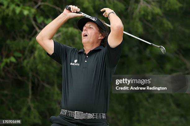 Phil Mickelson of the United States reacts after chipping to the second green during the final round of the 113th U.S. Open at Merion Golf Club on...