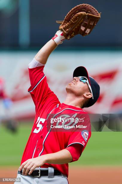 First baseman Adam LaRoche of the Washington Nationals catches a pop fly hit by Carlos Santana of the Cleveland Indians to end the first inning at...