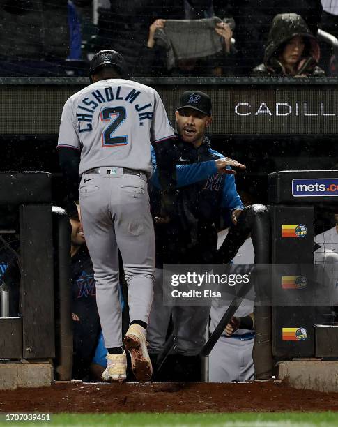 Manager Skip Schumaker of the Miami Marlins congratulates Jazz Chisholm Jr. #2 after he scored in the ninth inning against the New York Mets at Citi...