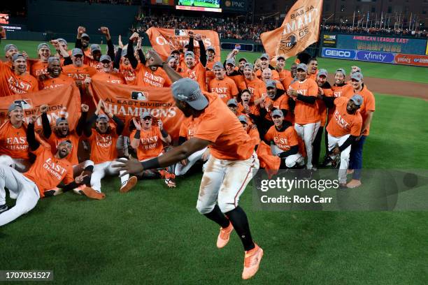 Jorge Mateo of the Baltimore Orioles celebrates with the team while posing for a group photo after the Orioles defeated the Boston Red Sox to win the...