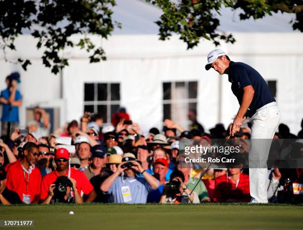 Justin Rose of England hits a chip shot on the 18th green during the final round of the 113th U.S. Open at Merion Golf Club on June 16, 2013 in...
