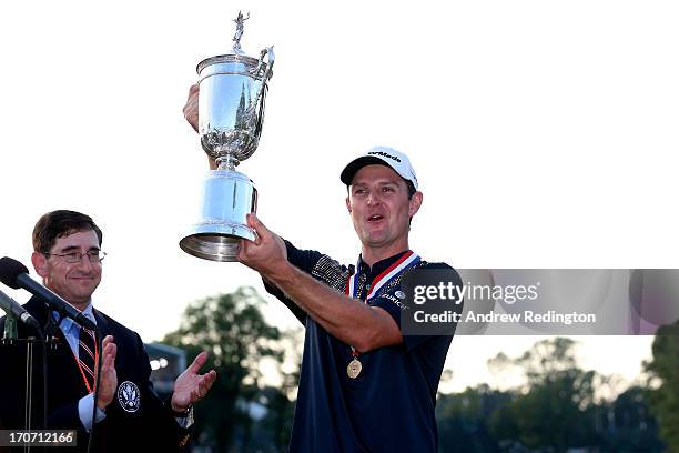 Justin Rose of England celebrates with the U.S. Open trophy after winning the 113th U.S. Open at Merion Golf Club on June 16, 2013 in Ardmore,...