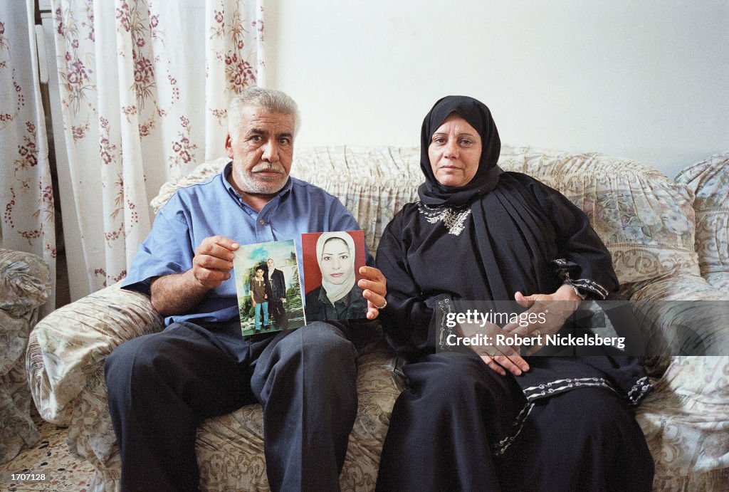 Parents Of Second Female Suicide Bomber Hold Pictures Of Daughter