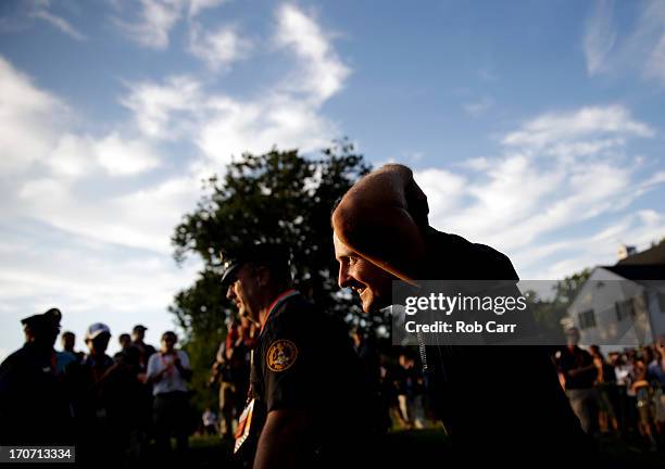 Justin Rose of England is congratulated as he walks to the trophy presentation after winning the 113th U.S. Open at Merion Golf Club on June 16, 2013...