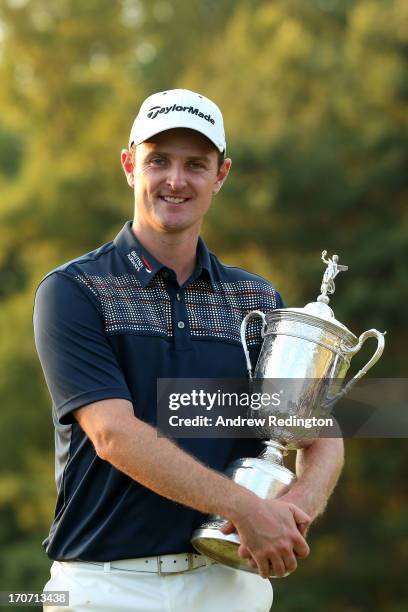 Justin Rose of England celebrates with the U.S. Open trophy after winning the 113th U.S. Open at Merion Golf Club on June 16, 2013 in Ardmore,...