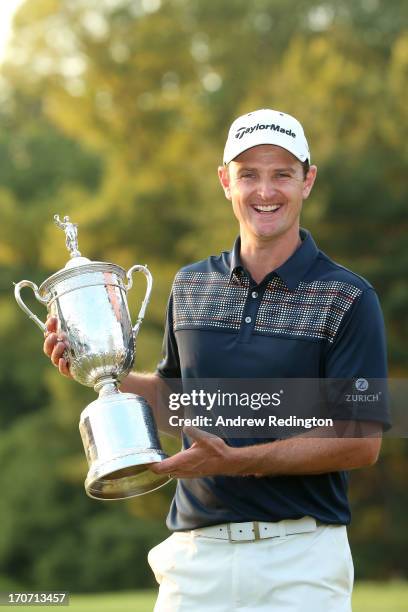 Justin Rose of England celebrates with the U.S. Open trophy after winning the 113th U.S. Open at Merion Golf Club on June 16, 2013 in Ardmore,...