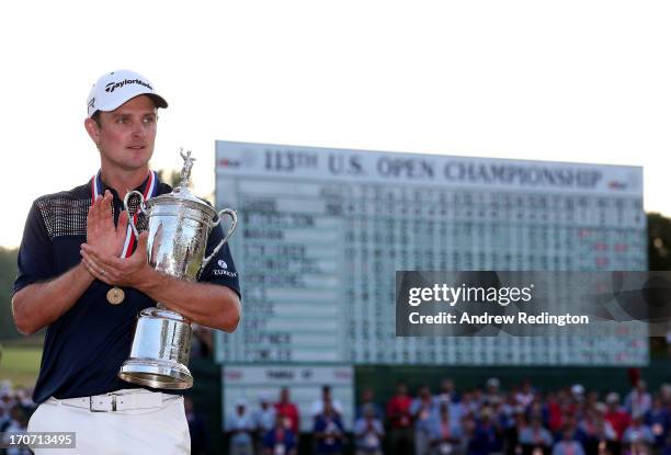 Justin Rose of England celebrates with the U.S. Open trophy after winning the 113th U.S. Open at Merion Golf Club on June 16, 2013 in Ardmore,...