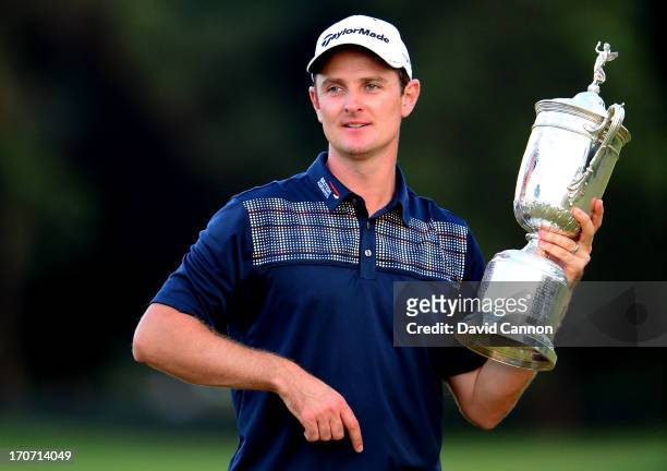 Justin Rose of England celebrates with the U.S. Open trophy after winning the 113th U.S. Open at Merion Golf Club on June 16, 2013 in Ardmore,...