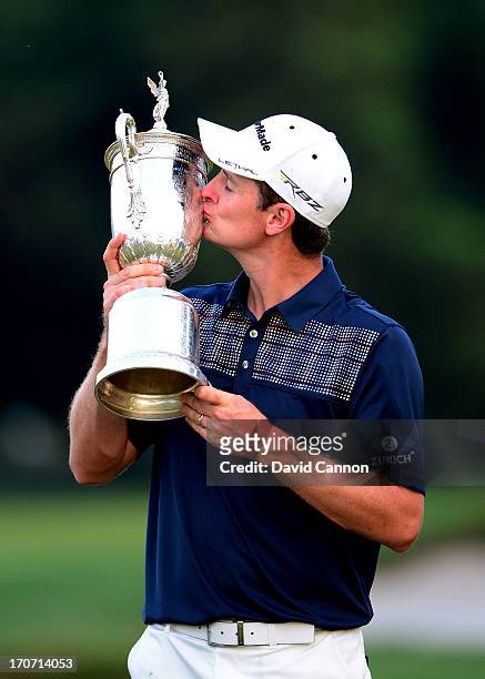 Justin Rose of England kisses the U.S. Open trophy after winning the 113th U.S. Open at Merion Golf Club on June 16, 2013 in Ardmore, Pennsylvania.