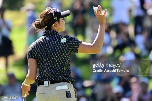 Erika Hara of Japan acknowledges the gallery after holing out on the 9th green during the second round of the Japan Women's Open Golf Championship at...