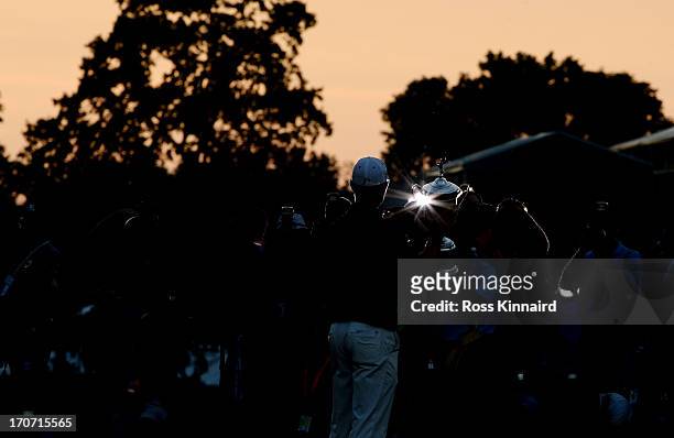 The media photographs Justin Rose of England as he celebrates with the U.S. Open trophy after winning the 113th U.S. Open at Merion Golf Club on June...