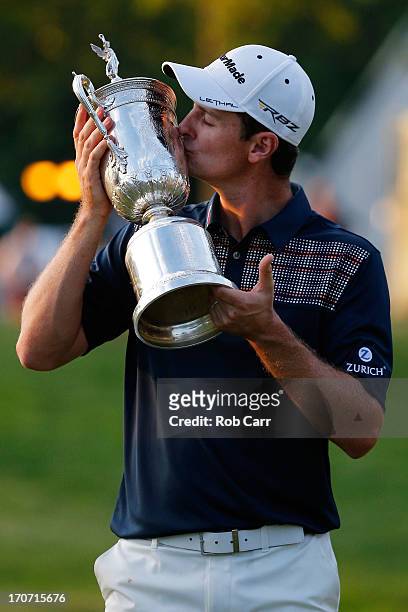 Justin Rose of England kisses with the U.S. Open trophy after winning the 113th U.S. Open at Merion Golf Club on June 16, 2013 in Ardmore,...