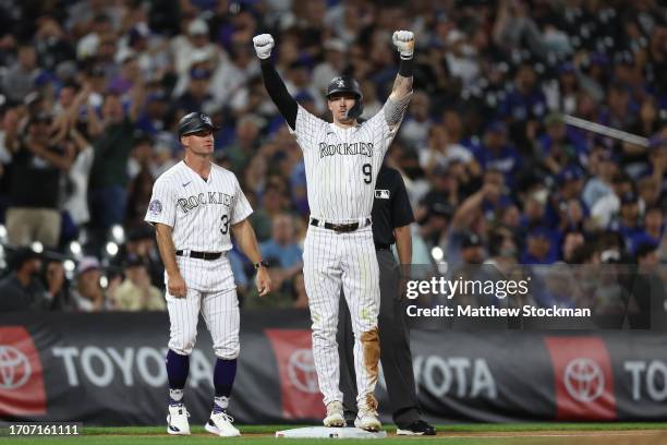 Brenton Doyle of the Colorado Rockies celebrates after hitting a two RBI triple against the Los Angeles Dodgers in the seventh inning at Coors Field...