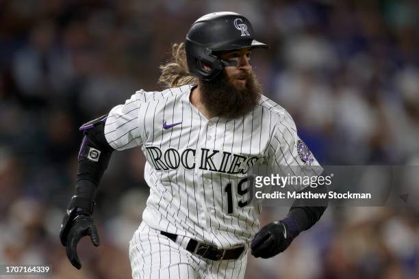 Charlie Blackmon of the Colorado Rockies runs the baseline after hitting a RBI double against the Los Angeles Dodgers in the seventh inning at Coors...