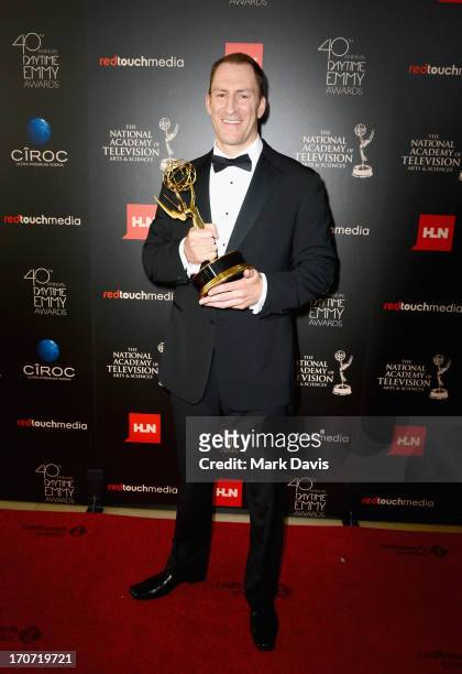 Personality Ben Bailey poses with the Outstanding Game Show Host award for "Cash Cab" in the press room during The 40th Annual Daytime Emmy Awards at...