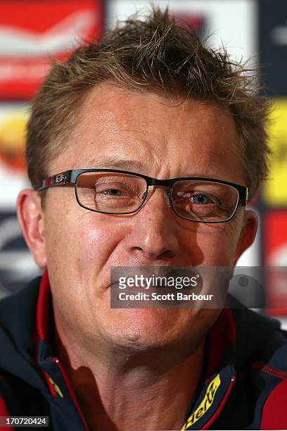 Former Demons coach Mark Neeld looks on as Demons Chief Executive Peter Jackson announces that Neeld has been sacked during a Melbourne Demons AFL...