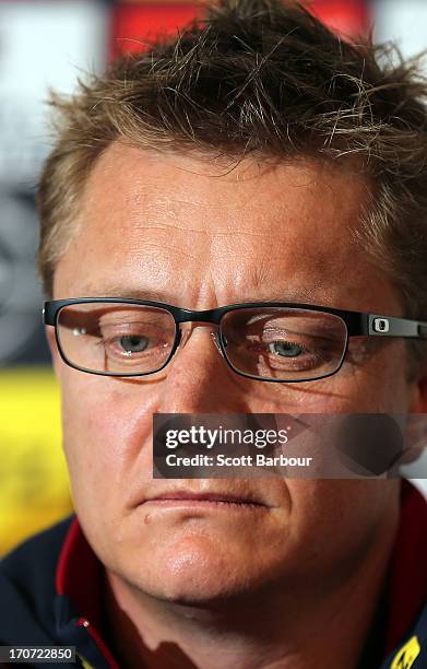 Former Demons coach Mark Neeld looks on as Demons Chief Executive Peter Jackson announces that Neeld has been sacked during a Melbourne Demons AFL...