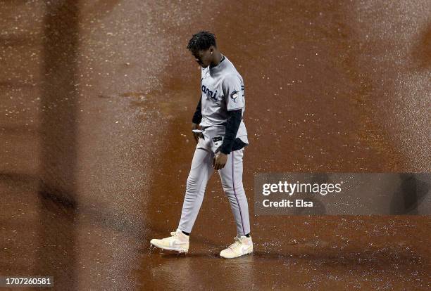 Jazz Chisholm Jr. #2 of the Miami Marlins walks off the field after the game was called for the night against the New York Mets at Citi Field on...