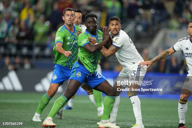 Seattle Sounders defender Yeimar Gómez Andrade battles LA Galaxy defender Tony Alfar0 for position during an MLS matchup between the Seattle Sounders...