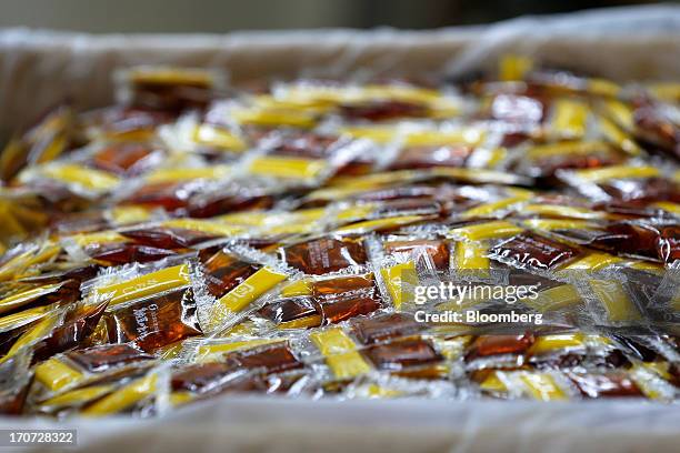 Sachets of seasoning sauce and mustard to accompany packets of fermented soybeans, known as natto, sit in a box at the Matsushita Shoten Y.K....