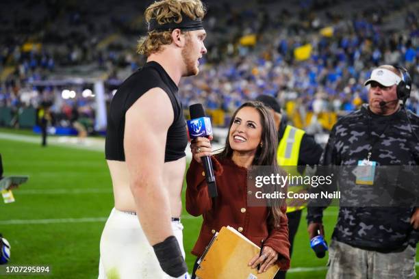 Aidan Hutchinson of the Detroit Lions is interviewed by Kaylee Hartung after at Lambeau Field on September 28, 2023 in Green Bay, Wisconsin.
