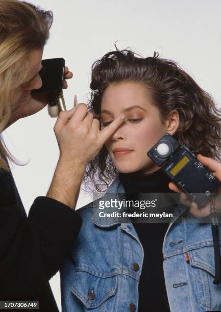 Makeup session for the american model Christy Turlington. New York November 1986.