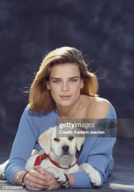 Princess Stephanie of Monaco with a dog during a shooting in studio. Paris, 11 April 1991.