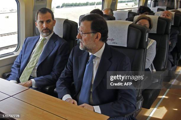 Spain's Crown Prince Felipe and Spanish Prime Minister and PP leader Mariano Rajoy take part in the inauguration of the high-speed track connecting...