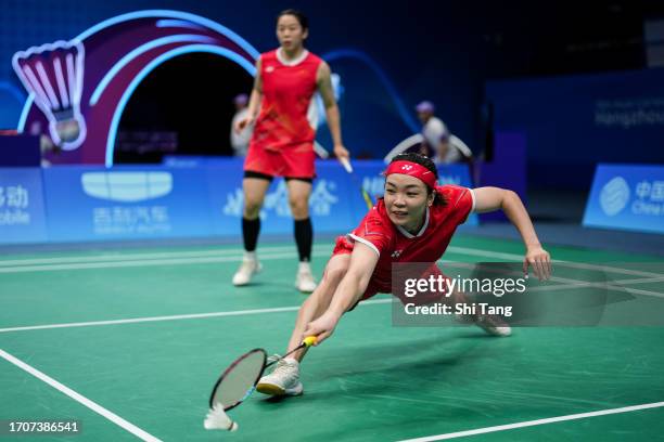 Chen Qingchen and Jia Yifan of China compete in the Badminton Women's Team Quarter Finals match against Rahayu Apriyani and Ramadhanti Siti Fadia...