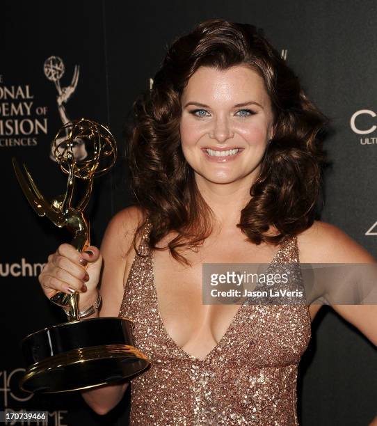 Actress Heather Tom poses in the press room at the 40th annual Daytime Emmy Awards at The Beverly Hilton Hotel on June 16, 2013 in Beverly Hills,...