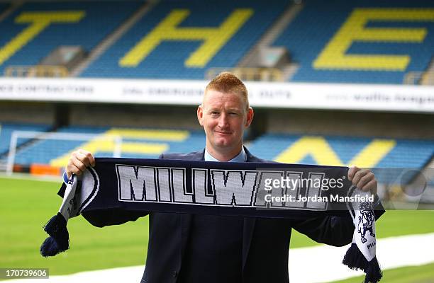 New Millwall FC manager Steve Lomas poses for a photo with a Millwall scarf after the Millwall FC Press Conference at The Den on June 17, 2013 in...