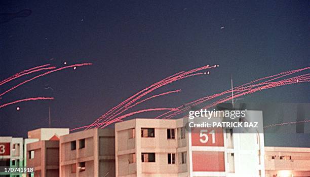 Red traces of anti-aircraft machine gun fire sear across Baghdad's skyline 19 December. Several missiles crashed into Baghdad almost immediately...