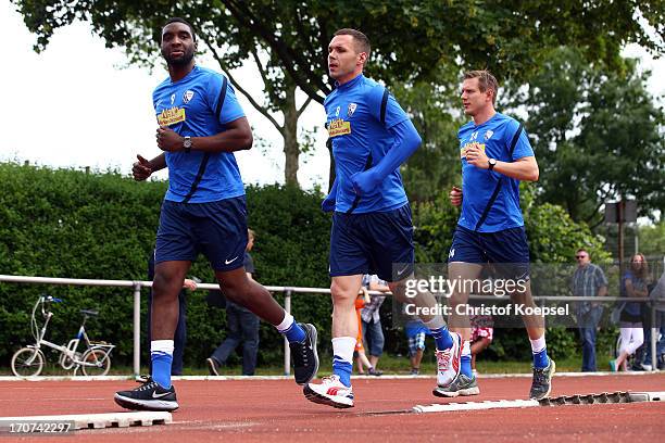 Richard Sukuta-Pasu, Christian Tiffert and Carsten Rothenbach of VfL Bochum take part in a fitness test at the club's training ground on June 17,...