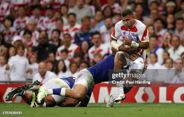 Jone Naikabula of Japan is tackled by Christian Leali'ifano of Samoa during the Rugby World Cup France 2023 match between Japan and Samoa at Stadium...