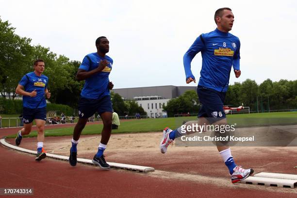 Carsten Rothenbach, Richard Sukuta-Pasu and Christian Tiffert of VfL Bochum take part in a fitness test at the club's training ground on June 17,...