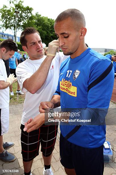Smail Morabit of VfL Bochum gives blood during a fitness test at the club's training ground on June 17, 2013 in Bochum, Germany.