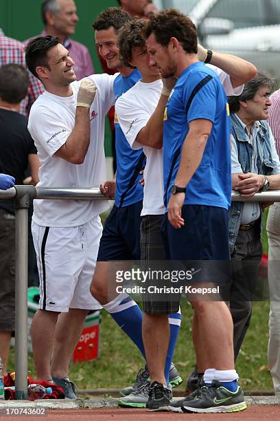 Marcel Maltritz and Paul Freier give blood during a fitness test at the club's training ground on June 17, 2013 in Bochum, Germany.