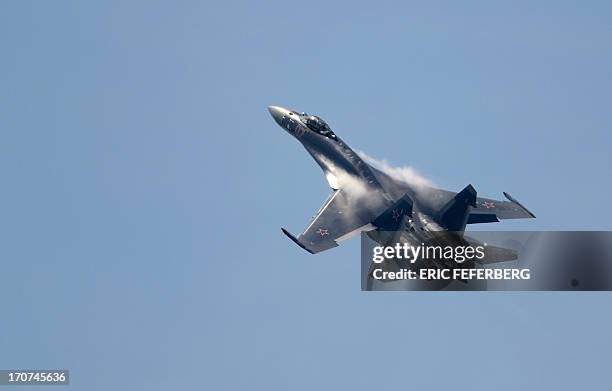 Russian Sukhoi 35 flies over Le Bourget airport on June 17, 2013 on the opening day of the International Paris Air show. AFP PHOTO / ERIC FEFERBERG