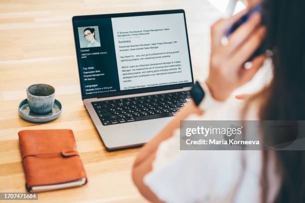 young business woman searching for job online. woman writing resume on laptop. - aanvraagformulier stockfoto's en -beelden