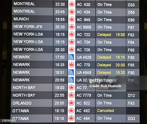 The departure board at T1 shows some delays and two cancelled flights. Some passengers are stranded in Toronto as they try to make their way to New...