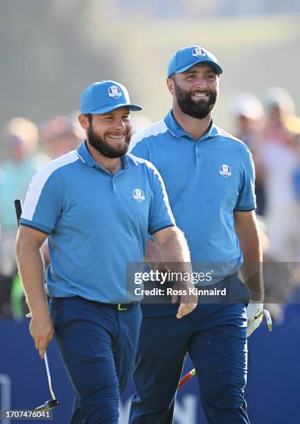 Jon Rahm and Tyrrell Hatton of Team Europe react on the seventh hole during the Friday morning foursomes matches of the 2023 Ryder Cup at Marco...