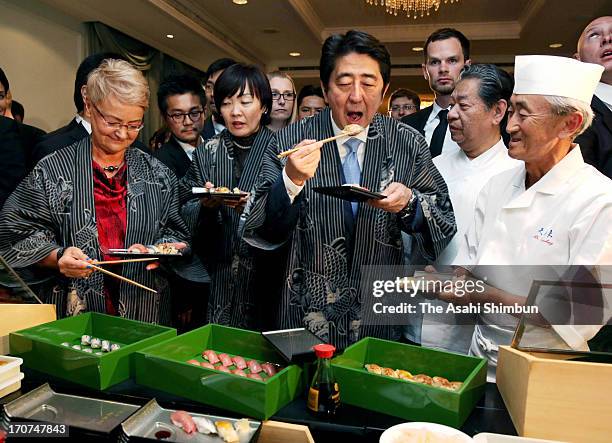 Japanese Prime Minister Shinzo Abe and his wife Akie eat Sushi to promote the Japanese food and its safety ahead of the V4+Japan Prime Ministers...