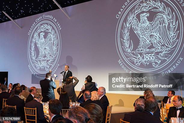 Bordeaux Mayor Alain Juppe, rear, delivers a speech during the dinner of Conseil des Grand Crus Classes of 1855 hosted by Chateau Mouton Rothschild...