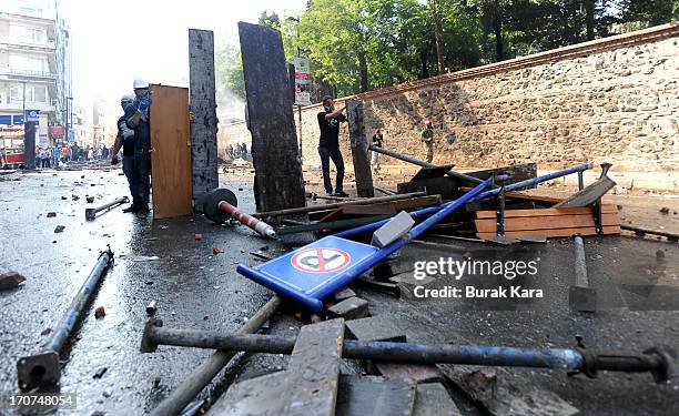 Anti-government protesters stand behind barricades during clashes with police in Kurtulus district on June 16, 2013 in Istanbul, Turkey. Protests...