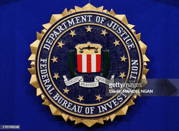 The Federal Bureau of Investigation seal is seen on the lectern following a press conference announcing the FBI's 499th and 500th additions to the...